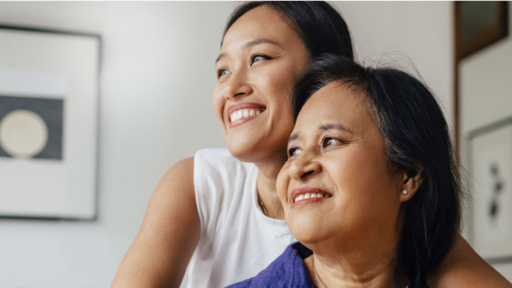 Mother and daughter smiling.